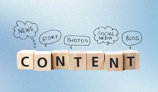 A row of wooden letter blocks spread out to spell "content," showing the concept of content marketing